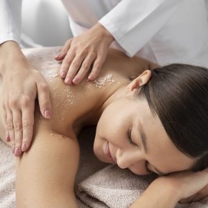 high-angle-woman-getting-massaged-spa (1)